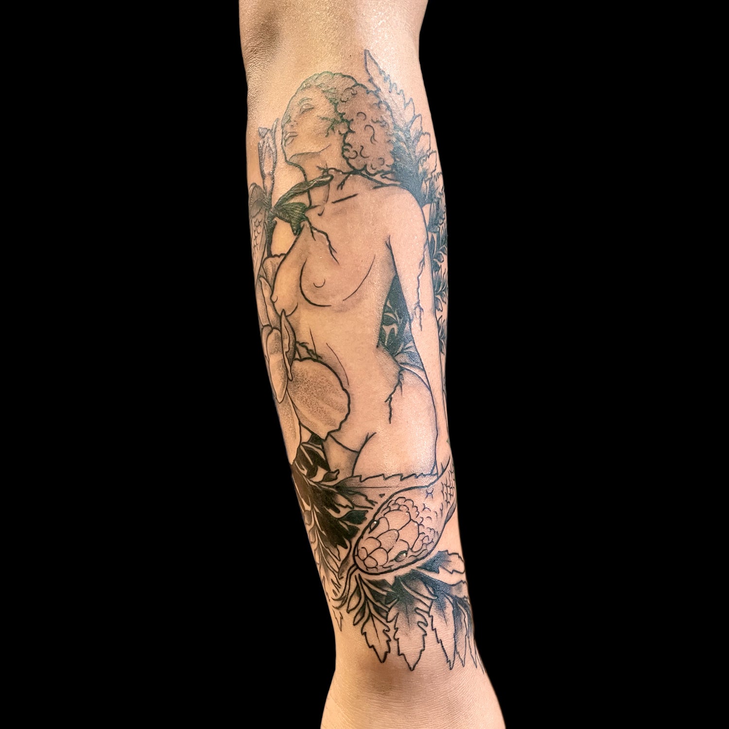 woman and snake tattoo forearm sleeve by Cass Brown