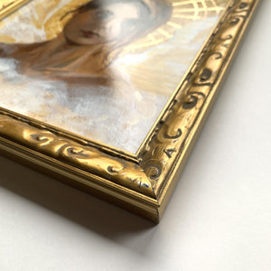 angel art in gold frame detail