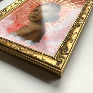 angel artwork in gold frame