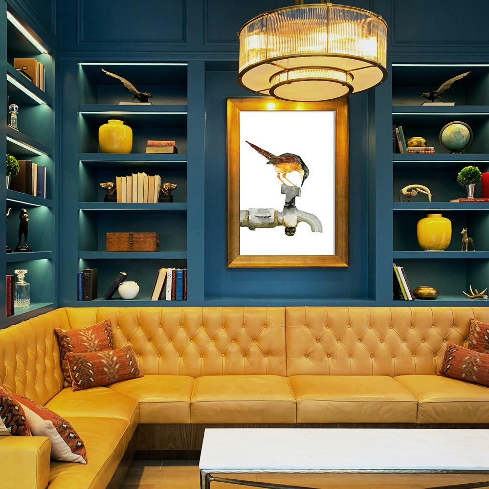 ashy prinia bird on faucet art print framed above yellow sofa