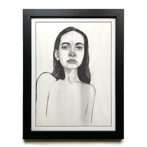 charcoal face drawing of girl in black frame