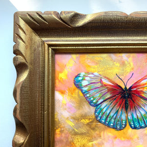 Colorful teal, red, pink, yellow summer butterfly original painting in an antique gold wood frame detail