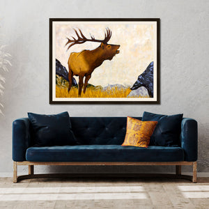 large elk art print framed on wall over velvet sofa