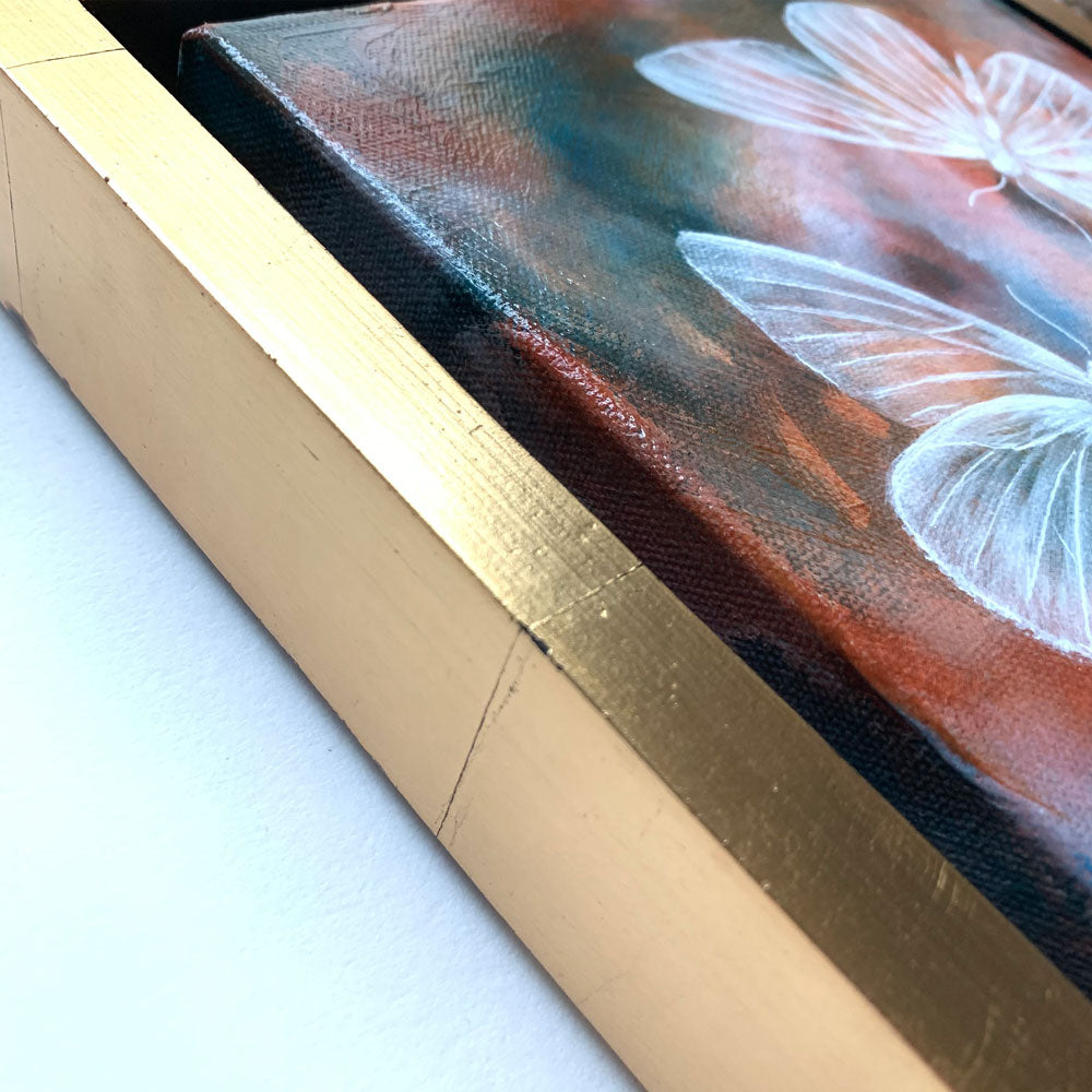 frame detail of ethereal moths colorful original painting by Aimee Schreiber in a gold floater frame