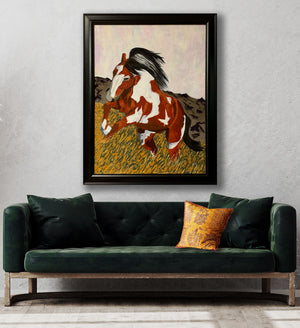 horse animal painting in black frame over green sofa