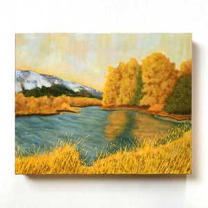 landscape painting of yellow trees and blue lake by Danny Schreiber