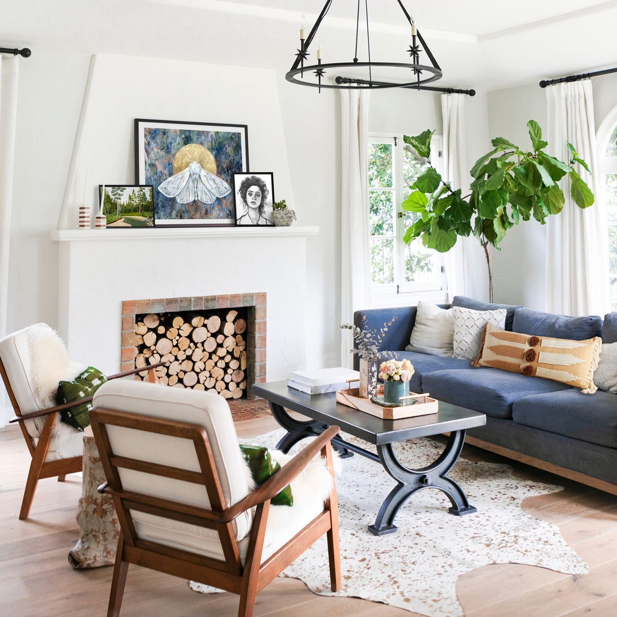 white moth art print on fireplace mantle