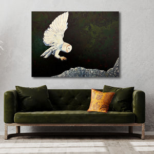 large owl painting over green sofa