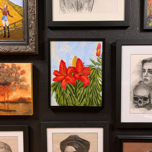 red lily painting on gallery wall 