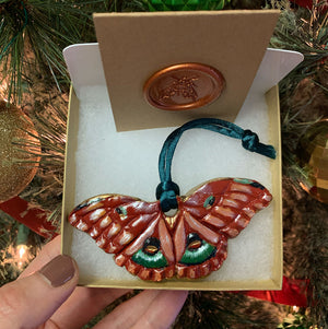 red moth christmas ornament in gift box