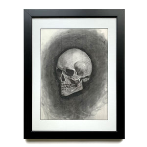 skull charcoal drawing in black frame