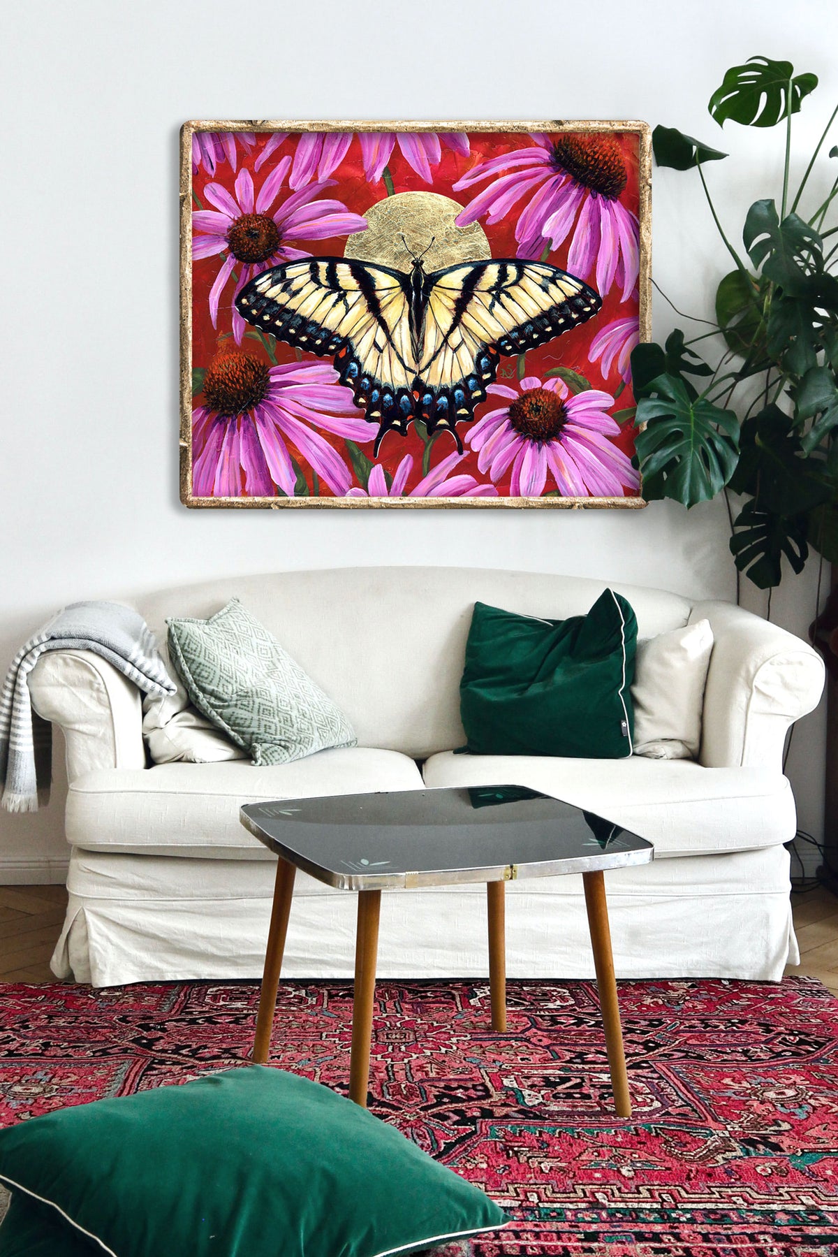 yellow butterfly art print with purple flowers hanging on wall over white sofa