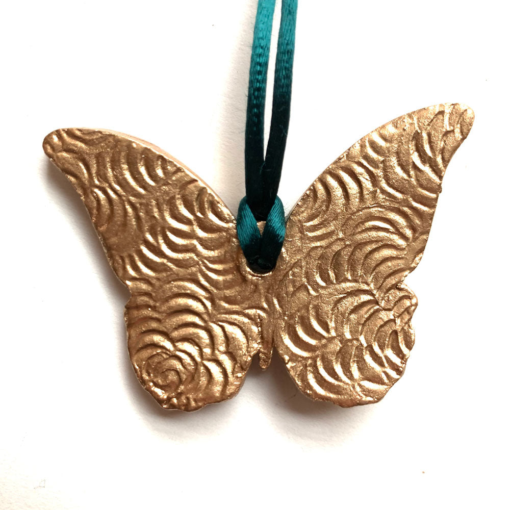 teal rust gold butterfly ornament back texture