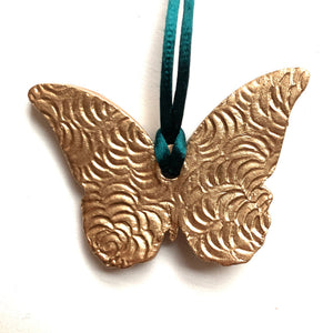 teal rust gold butterfly ornament back texture